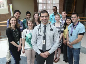 Dr. Wassim Saad received the CAME Canada Association of Medical Educators certificate of merit award for his dedication to medical education. Dr. Saad is shown with members of the Clinical Teaching Unit consisting of residents, medical students and pharmacists based in the Ouellette Campus of Windsor Regional Hospital.  (JASON KRYK/The Windsor Star)