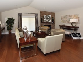 Pewter artwork and accents liven neutral sofa and chairs.
- Ed Goodfellow photo