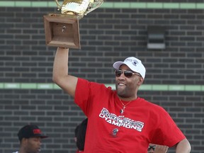 Windsor Express head coach, Bill Jones, holds up the NBL championship trophy during a celebration for the Windsor Express' consecutive NBL Championship at the Riverfront Festival Plaza, Sunday, May 3, 2015.  (DAX MELMER/The Windsor Star)