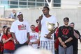 Windsor Express player, Chris Commons, gives a speech to fans while holding the NBL championship trophy during a celebration for the Windsor Express' consecutive NBL Championship at the Riverfront Festival Plaza, Sunday, May 3, 2015.  (DAX MELMER/The Windsor Star)