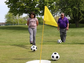 Anna Masoaovich, left and Bill Marshall play a round of Footgolf at Little River Golf Course on May 14, 2015. (JASON KRYK/The Windsor Star)