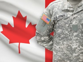 American soldier with flag on background - Canada, by fotolia.com.