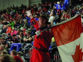 Mark Lefebvre (aka the 'Stilt Guy') gives a patriotic salute during the recent Windsor-Essex Great Lakes Regional FIRST (For Inspiration and Recognition of Science and Technology) Robotics tournament at the University of Windsor. - Rick Dawes photo