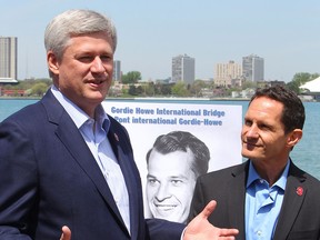 Prime Minister Stephen Harper speaks next to Murray Howe, Gordie Howe's son, as they announce that the Detroit River International Crossing will be named the Gordie Howe International Bridge, on the waterfront, in Windsor, Ontario, Thursday May 14, 2015. THE CANADIAN PRESS/Dave Chidley