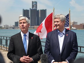 Michigan Governor Rick Snyder, left, and Prime Minister Stephen Harper announce that the Detroit River International Crossing will be named the Gordie Howe International Bridge, on the waterfront, in Windsor, ON., Thursday May 14, 2015.  (DAN JANISSE/The Windsor Star)