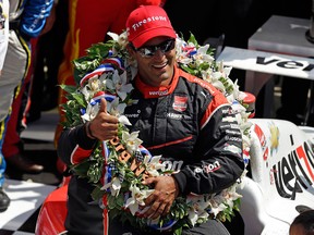 Juan Pablo Montoya, of Colombia, celebrates after winning the 99th running of the Indianapolis 500 auto race at Indianapolis Motor Speedway in Indianapolis, Sunday, May 24, 2015.  (AP Photo/Michael Conroy)