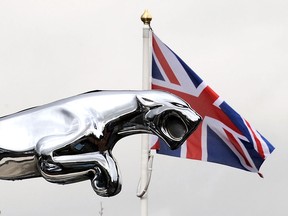 A silver Jaguar emblem is pictured outside a Jaguar car sales dealership in Manchester, north-west , England. (Getty Images files)