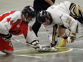 Point Edward Pacers Brett Barnes, left battles with Windsor Clippers Austin Thompson during Ontario Junior B Lacrosse action on May 13, 2015 at Forest Glade Arena. (JASON KRYK/The Windsor Star)