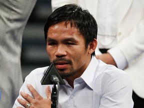 Manny Pacquiao answers questions during a press conference following his welterweight title fight against Floyd Mayweather Jr. in Las Vegas on May 2, 2015. (John Locher/The Associated Press)