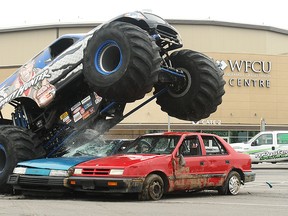 Bounty Hunter, a monster truck driven by Jimmy Creten, makes short work of a couple cars at the WFCU Centre in this 2010 file photo. Monster Spectacular returns to Windsor on Saturday, May 23. (Tyler Brownbridge / The Windsor Star)