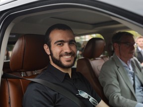 In this file photo, Omar Khadr, left, with his lawyer Dennis Edney arrives at Edney's home in Edmonton, Thursday, May 7, 2015. The former Guantanamo Bay prisoner Omar Khadr got his first taste of freedom in almost 13 years. THE CANADIAN PRESS/Nathan Denette