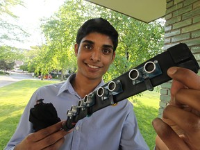 Alex Deans, 18, won the Ontario Science Centre's 2015 Weston Youth Innovation Award.  He won $2,000 for a device that uses ultrasonic sensors to help visually impaired people get around.  The device is called the iAid.  (JASON KRYK/The Windsor Star)