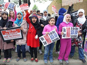 Students participate in a protest on Tuesday, May 5, 2015, in front of the Northwood Public School in Windsor, Ont. The students and parents are upset with the proposed sex education curriculum in school.  (DAN JANISSE/The Windsor Star)