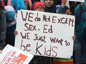 Students participate in a protest on Tuesday, May 5, 2015, in front of the Northwood Public School in Windsor, ON. The students and parents are upset with the proposed sex education curriculum in school.  (DAN JANISSE/The Windsor Star)