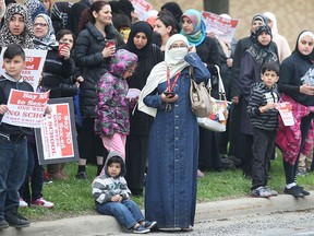 Parents and students participate in a protest on Tuesday, May 5, 2015, in front of the Northwood Public School in Windsor, ON. The students and parents are upset with the proposed sex education curriculum in school.  (DAN JANISSE/The Windsor Star)