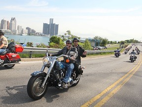 Riders in the Windsor Telus Motorcycle Ride for Dad cruised down Riverside Dr. West this morning to start their parade through Essex County, Sunday, May 24, 2015.   (DAX MELMER/The Windsor Star)