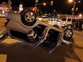 Windsor Police investigate at the scene of a two car accident at the corner of Tecumseh Road and Howard Avenue in Windsor on Tuesday, May 19, 2015. The accident happened just before 10 p.m.              (TYLER BROWNBRIDGE/The Windsor Star)