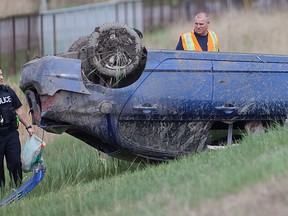 Emergency crews tend to a single vehicle rollover on E.C. Row Expressway west bound, east of the Howard Ave. off ramp, Saturday, May 9, 2015.  (DAX MELMER/The Windsor Star)