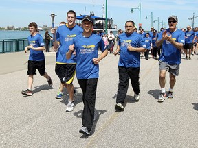 The Law Enforcement Torch Run For Special Olympics heads out from Festival Plaza in Windsor on Thursday, May 14, 2015. The annual event raises money for the Special Olympics program as well as year round programs.             (TYLER BROWNBRIDGE/The Windsor Star)