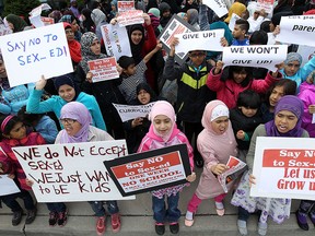 Parents and children take part in a protest against the new sex education curriculum outside of the GECDSB offices in Windsor on Wednesday, May 6, 2015.                  (TYLER BROWNBRIDGE/The Windsor Star)