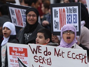 Parents and children take part in a protest against the new sex education curriculum outside of the GECDSB offices in Windsor on Wednesday, May 6, 2015.                  (TYLER BROWNBRIDGE/The Windsor Star)
