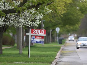 A sold sign is shown at a home on Westminster Boulevard on Tuesday, May 5, 2015, in Windsor, Ont. Local home sales are on the rise. (DAN JANISSE/The Windsor Star)