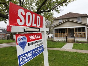 A sold sign is shown at a home on Westminster Blvd. on Tuesday, May 5, 2015, in Windsor, ON. Local home sales are on the rise. (DAN JANISSE/The Windsor Star)