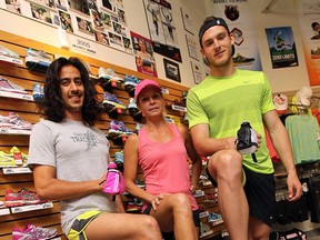 Andrew Aguanno, left, Kelly Steele and Jesse Drennan sport new warm weather gear at the Running Factory on May 12, 2015. (TYLER BROWNBRIDGE/The Windsor Star)