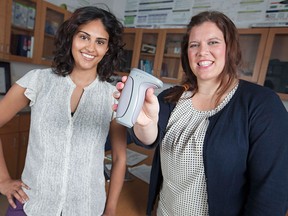 Yasina Somani, 25, left, and Kristin Mayrand, 24, pictured in the department of kinesiology at the University of Windsor, Wednesday, May 13, 2015, are looking for participants for a hand grip study to evaluate high blood pressure.   (DAX MELMER/The Windsor Star)