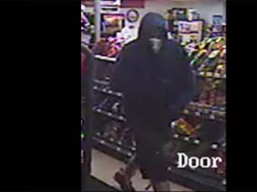 Surveillance photo of a suspect wanted in connection with a robbery at Mac's Convenience in the 200 block of Strabana Avenue on Monday, May 11, 2015. (Courtesy of Mac's Crime Busters)