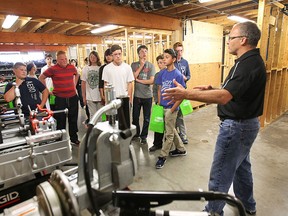 St. Clair College plumbing teacher Greg Ducharme speaks to a group of grade 8 students during a tour of the school's technical programs on Tuesday, May 26, 2015, in Windsor, ON. The Public School board wants to expose students to skill trades as a career at a early age.  (DAN JANISSE/The Windsor Star)