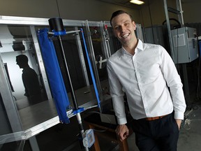 Kyle Bassett is photographed with the prototype of his portable wind turbine as the University of Windsor in Windsor on Thursday, April 30, 2015.                  (TYLER BROWNBRIDGE/The Windsor Star)