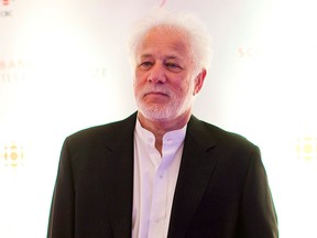 Canadian author Michael Ondaatje is among a group of at least six writers who have withdrawn from next month's PEN American Center gala, citing objections to the literary and human rights organization's honouring the French satirical magazine Charlie Hebdo. Ondaatje is shown in Toronto on Tuesday, November 8, 2011. THE CANADIAN PRESS/Chris Young