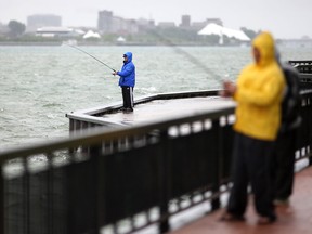 Fisherman brave the cold and rain along Windsor's riverfront, Sunday, May 31, 2015.  (DAX MELMER/The Windsor Star)