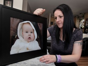 Jen Bois with portrait of her daughter Kylee Grace Cooper-Bois, nine months old, who passed away last December just days before a scheduled liver transplant. Bois is holding blood drive on June 13th, 2015. In addition, registry for both organ donation and stem cell will be available. (NICK BRANCACCIO/The Windsor Star)