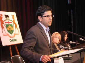 Community Safety Minister Yasir Naqvi speaks at a press conference on Oct. 15, 2014. Ontario's Liberal government will bring in regulations to standardize police street checks, a controversial tactic known in Toronto as carding. THE CANADIAN PRESS/Colin Perkel