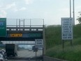 A sign directing transport trucks carrying hazardous material to take the Ambassador Bridge is pictured on I-75 in Detroit. (Handout/The Windsor Star)