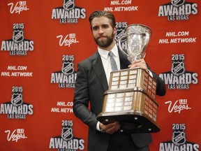 Florida Panthers' Aaron Ekblad poses with the Calder Memorial Trophy after winning the award at the NHL Awards show Wednesday, June 24, 2015, in Las Vegas. (AP Photo/John Locher)
