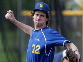 St. Anne Saints starting pitcher Mitchell Zimmerman tosses a knuckleball during final workout before Wednesday's OFSSA game in London.  The team took batting practice and threw lightly at Lacasse Park in Tecumseh, Tuesday June 9, 2015. (NICK BRANCACCIO/The Windsor Star).