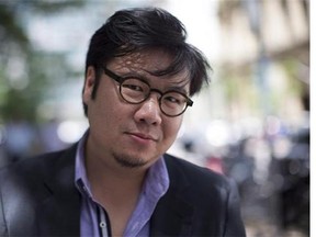 Following up on his bestselling debut novel, "Crazy Rich Asians," author Kevin Kwan wanted to tell an Asian version of "Downton Abbey" to reflect the region's rising wealth. Kwan poses for a photo to promote his debut novel, "Crazy Rich Asians" in Toronto on June 17, 2013. THE CANADIAN PRESS/Chris Young