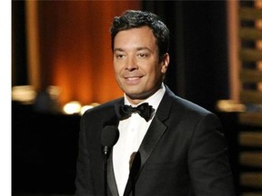FILE - In this Aug. 25, 2014 file photo, Jimmy Fallon presents an award at the 66th Annual Primetime Emmy Awards in Los Angeles. Fallon is on the shelf following a hand injury that required minor surgery Friday and forced NBC to cancel a taping of his late-night TV program, "The Tonight Show Starring Jimmy Fallon." Fallon was supposed to have Benicio Del Toro, Taylor Kitsch and Penn & Teller as guests Friday. NBC is airing a rerun instead. (Chris Pizzello/Invision/AP, File)