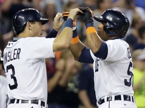 Yoenis Cespedes #52 of the Detroit Tigers celebrates his three-run home run against the Chicago Cubs with Ian Kinsler #3 of the Detroit Tigers during the sixth inning at Comerica Park on June 10, 2015 in Detroit, Michigan. (Photo by Duane Burleson/Getty Images)