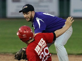 The Tecumseh Thunder's Chris Brisson tags the Amherstburg Cardinals Brad Lepine on a failed steal at Lacasse Field in Tecumseh on Thursday, June 11, 2015.               (TYLER BROWNBRIDGE/The Windsor Star)