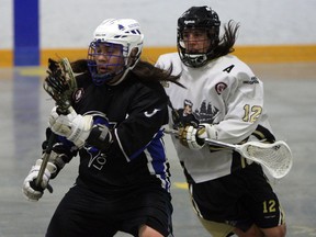 The Windsor Clippers Andrew Thompson chases down the London Blue Devils Brady Doxtator at Forest Glade Arena in Windsor on Thursday, June 18, 2015.                  (TYLER BROWNBRIDGE/The Windsor Star)