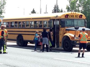 School children are transferred from one bus to another following a minor collision on Huron Church Road on Wednesday, June 24, 2015. (Nick Brancaccio/The Windsor Star)