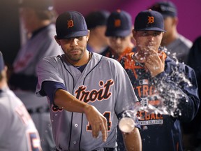 Detroit Tigers starting pitcher David Price tosses a cup of water after being taken out of the game in the eighth inning of a baseball game against the Los Angeles Angels, Sunday, May 31, 2015, in Anaheim, Calif. (AP Photo/Mark J. Terrill)
