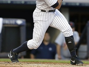 New York Yankees' Alex Rodriguez follows through on a home run for his 3,000th career hit, during the first inning of a baseball game against the Detroit Tigers on Friday, June 19, 2015, in New York. (AP Photo/Frank Franklin II)