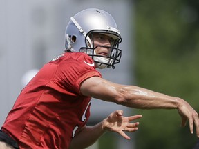 Detroit Lions quarterback Matthew Stafford throws during drills at NFL football minicamp, in Allen Park, Mich. (AP Photo/Carlos Osorio)