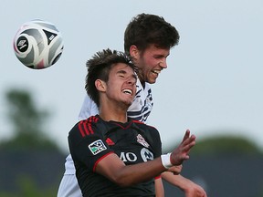 The Windsor Stars Micheal Pio and Robert Boskovic from Toronto FC head the ball at McHugh Park in Windsor on Tuesday, June 24, 2015.                  (TYLER BROWNBRIDGE/The Windsor Star)