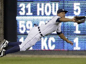 DETROIT, MI - JUNE 2:  Center fielder Anthony Gose #12 of the Detroit Tigers makes a diving catch on a fly ball hit by Ben Zobrist of the Oakland Athletics during the ninth inning at Comerica Park on June 2, 2015 in Detroit, Michigan. (Photo by Duane Burleson/Getty Images)